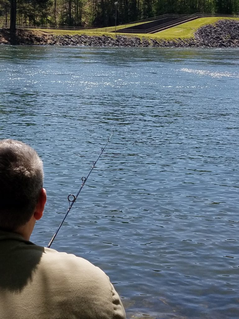 Jason, diligently fishing Lake Ouachita. No bites here, but it was a relaxing afternoon! #ParkTripsAndMore #travel #fishing #LakeOuachita #Arkansas