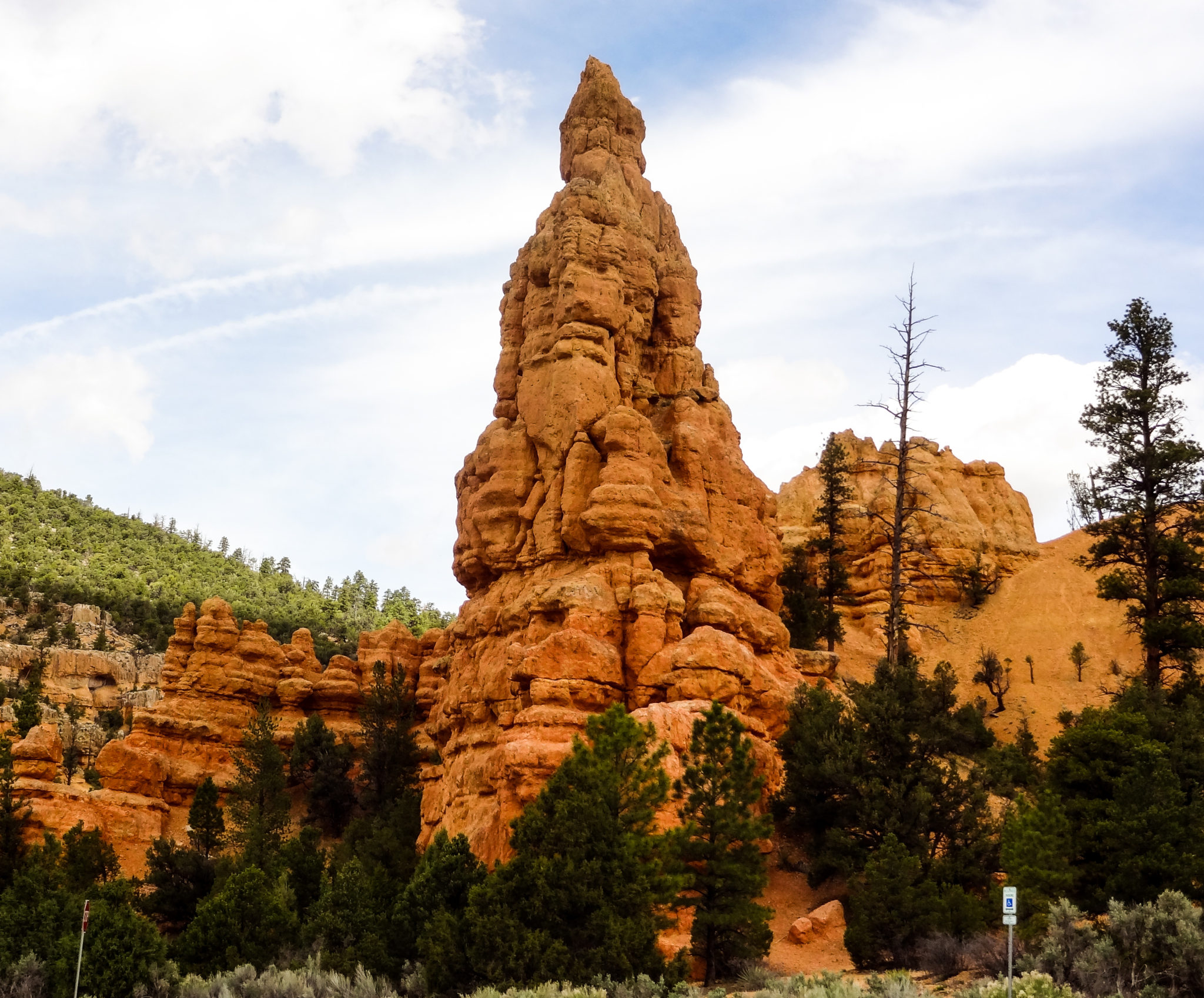 Red Canyon greets you as you approach Bryce Canyon National Park. This was a great surprise on our trip from Cedar Breaks to Bryce Canyon on our road trip from Las Vegas! #ParkTripsAndMore #RoadTrip