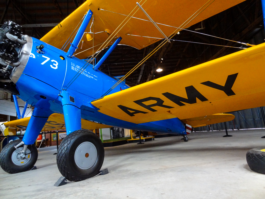 blue and yellow Army plane